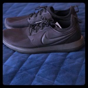 Woman’s Black Nike’s